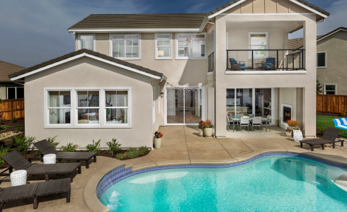 image of home's rear exterior with pool as example of preparing California home for summer